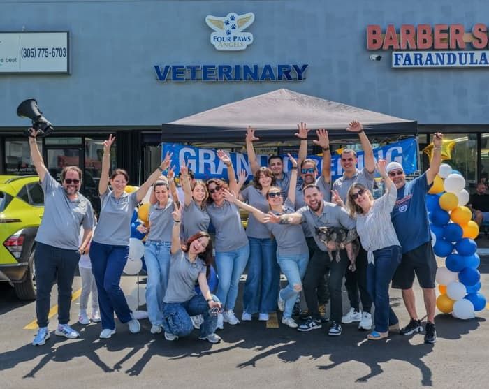 Four Paws Angels team celebrating outside the clinic